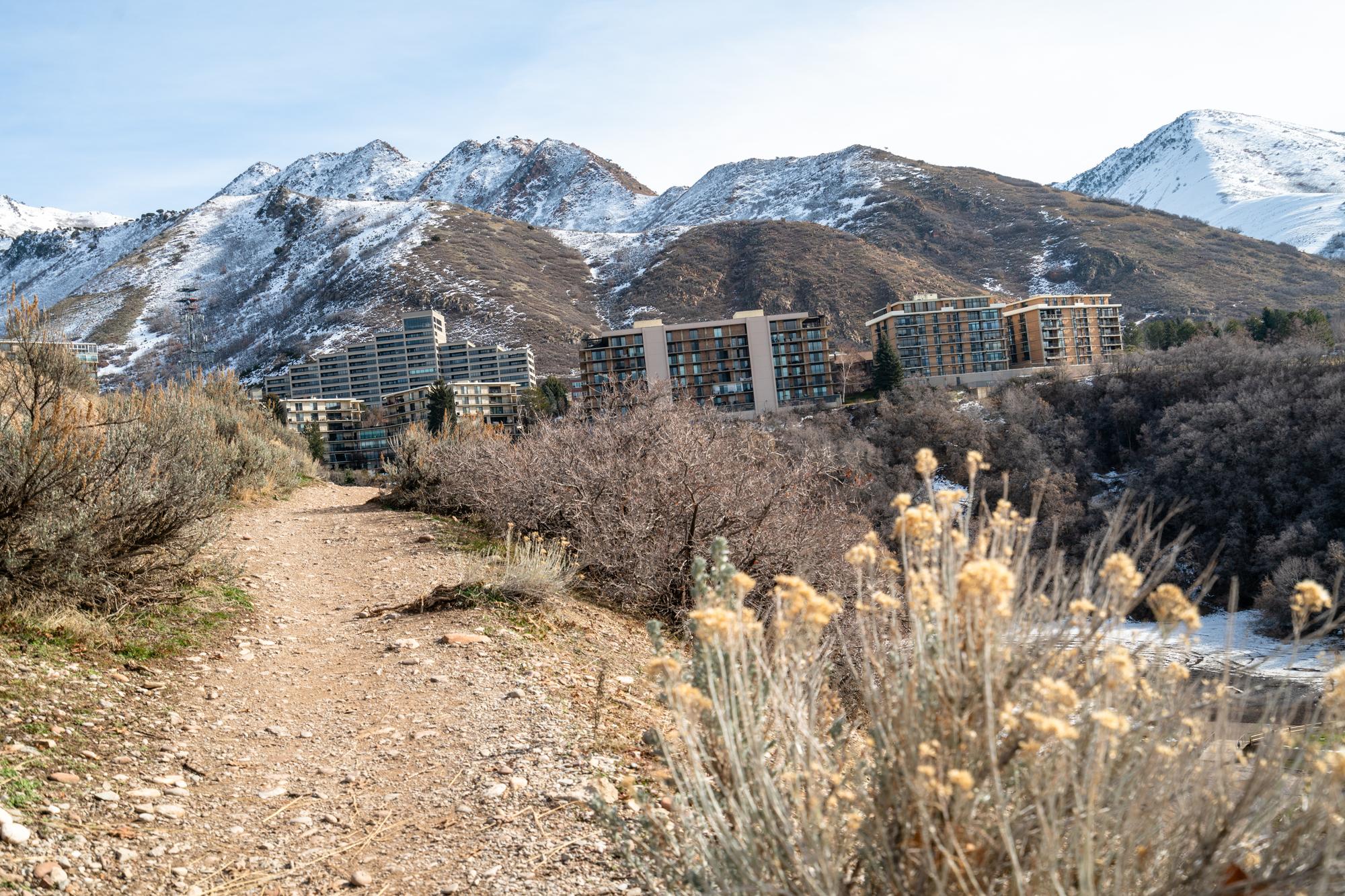 Heading up the Wagner Spring Trail with a view of buildings at the mouth of Emigration Canyon.